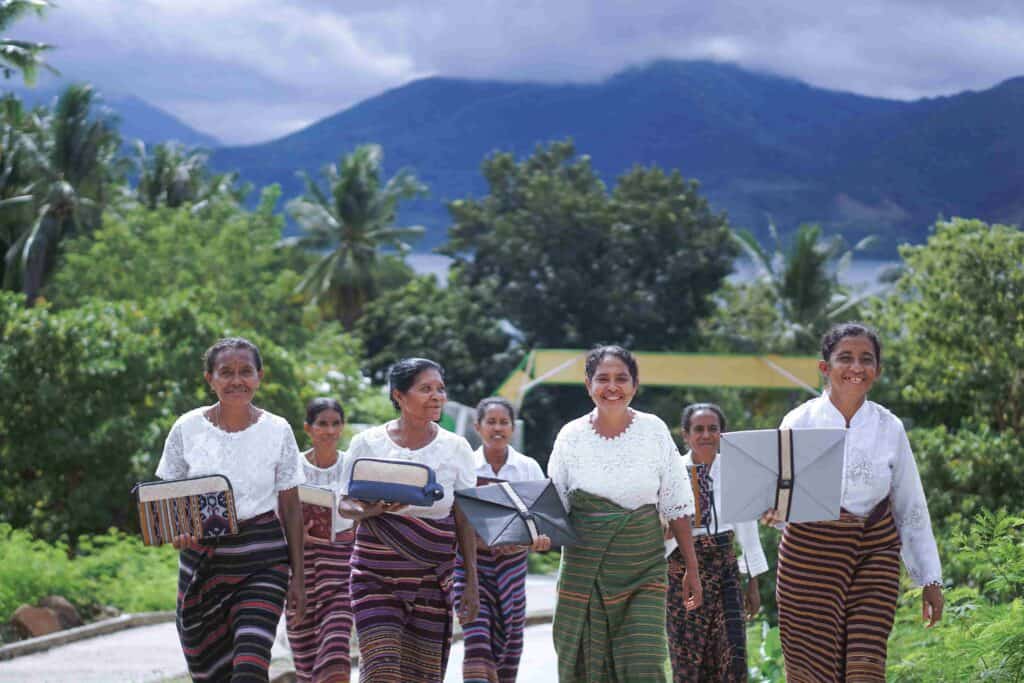 the women weavers holding the product